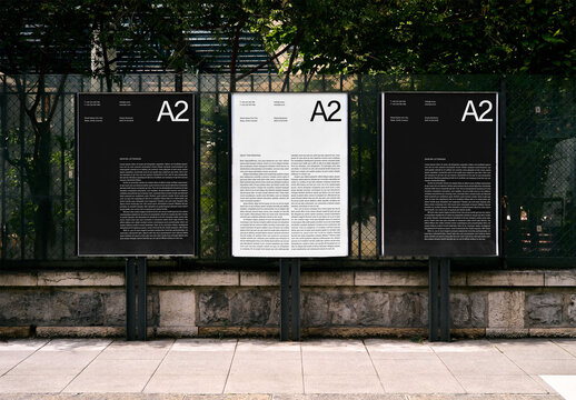 Mockup Of Three Vertical Customizable A2 Posters By Fence