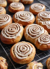Fototapeta premium Crumbly cinnamon roll dough on a cooling rack with sweet glaze, cinnamon roll, crumbly, cooling rack