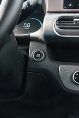 Fototapeta premium Car interior dashboard closeup showing steering wheel, controls, and dashboard details while parked in a lot