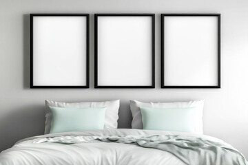 Blank framed posters above a bed in a modern minimalist decor room