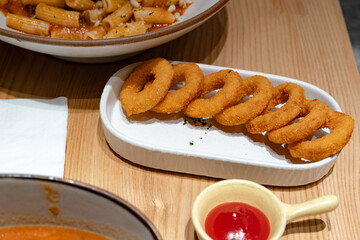 Eating with family in a restaurant, onion rings, fast food, fried food, small restaurant, pleasure and lifestyle