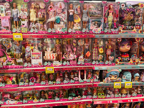 Lviv, Ukraine - February 16, 2025: Display of children's dolls on store shelves with colorful packaging.