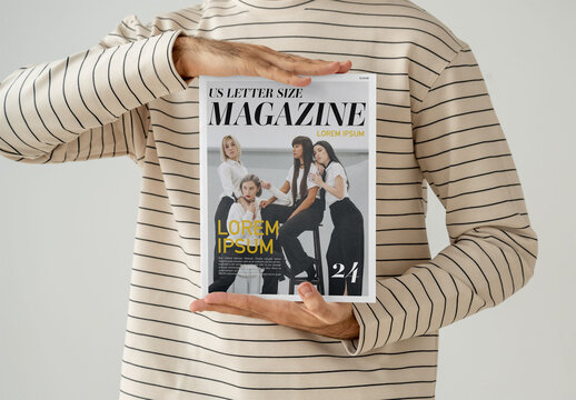 Mockup Of Man Holding Customized Saddle Stitch Magazine