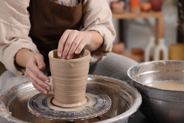 Hobby and craft. Woman making pottery indoors, closeup