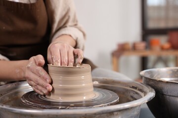 Hobby and craft. Woman making pottery indoors, closeup