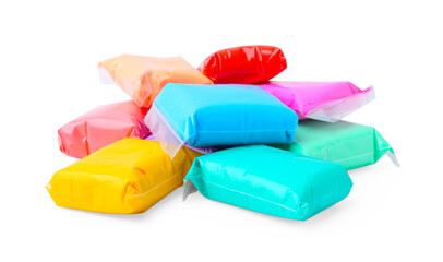 Different colorful play dough in packages isolated on white