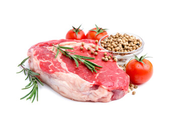 Piece of raw beef meat, tomatoes and spices isolated on white