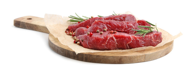 Pieces of raw beef meat, rosemary and peppercorns isolated on white