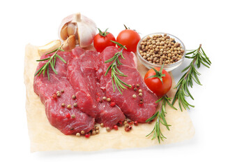 Pieces of raw beef meat, spices and tomatoes isolated on white