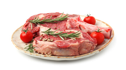 Pieces of raw beef meat, spices and tomatoes isolated on white