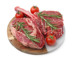 Pieces of raw beef meat, spices and tomatoes isolated on white