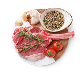 Piece of raw beef meat, spices and tomatoes isolated on white, top view