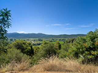 Meospotamos, Greece - July 3, 2024: Necromanteion of Acheron. Looking at the green agricultural hinterland under blue sky
