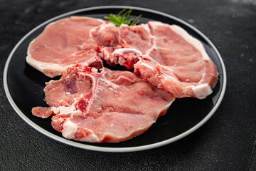 Raw pork on bones meat fresh tasty food dish delicious gourmet food background on the table rustic food top view copy space