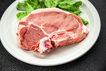 Raw pork on bones meat fresh tasty food dish delicious gourmet food background on the table rustic food top view copy space