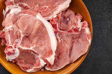 Raw pork on bones meat fresh tasty food dish delicious gourmet food background on the table rustic food top view copy space