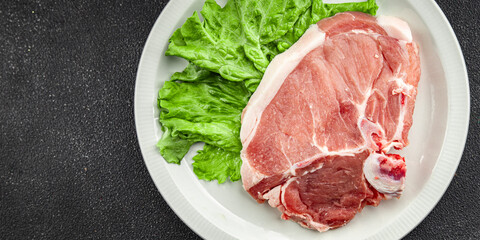 Raw pork on bones meat fresh tasty food dish delicious gourmet food background on the table rustic food top view copy space