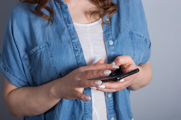 Close up of women's hands holding cell telephone