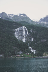 Norwegian village under a waterfall