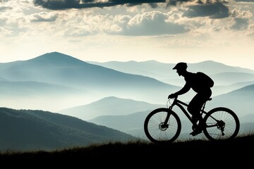 Fototapeta premium Silhouette of Cyclist Riding Mountain Bike Against Scenic Landscape