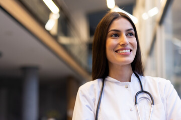 Fototapeta premium Successful Latina medical professional posing in a clinical setting