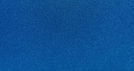 Blue glitter texture background, top view