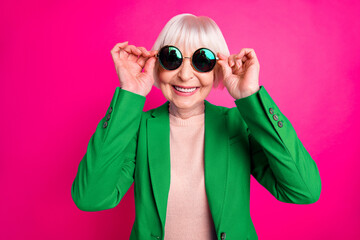 Close-up portrait of her she nice attractive cheerful cheery funky gray-haired lady wearing blue...