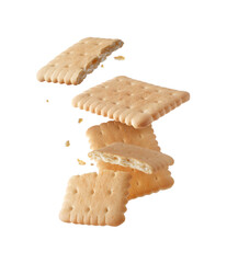 Whole and cracked crispy cookies in the air close-up isolated on white background