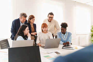 Startup team brainstorming innovative business strategy in modern office