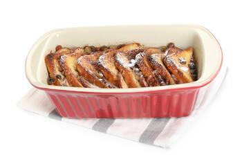 Freshly baked bread pudding in baking dish isolated on white