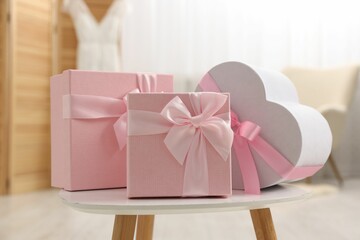 Different gift boxes on white table indoors