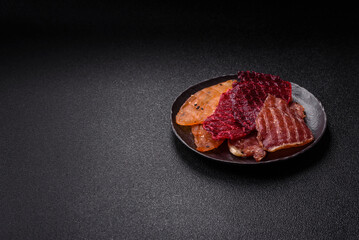Jerky, dried meat in the form of slices with salt, spices and herbs