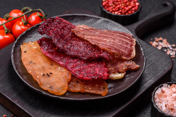 Jerky, dried meat in the form of slices with salt, spices and herbs