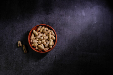 A photo of peanuts in a bowl