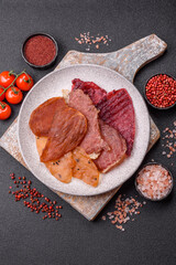 Jerky, dried meat in the form of slices with salt, spices and herbs