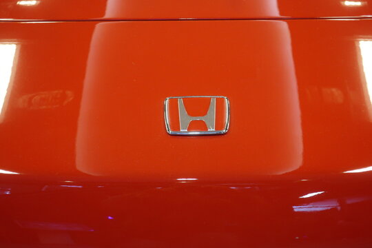 Honda emblem, logo, symbol on the hood of Honda NSX sport car (year 1990), closeup