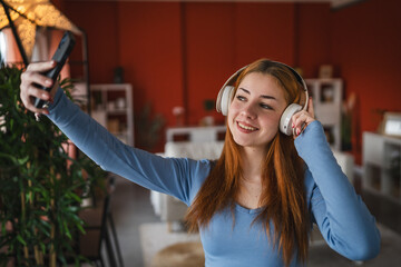 self portrait on mobile phone of young girl with headphones