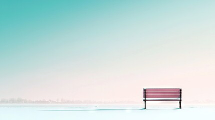   Red bench sits on snow-covered field near tall blue building in blue sky background