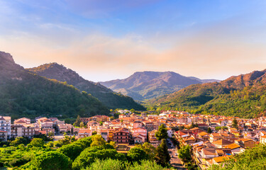 Mountain town view. Mountain landscape of  beautiful village in Sicily, Italy. A town in a beautiful mountain valley. Mountain valley town during sunset in evening light