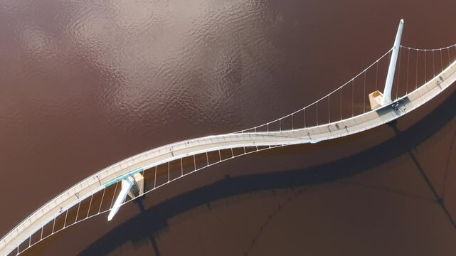 Peace Bridge over River Foyle in the City of Derry aka Londonderry in Northern Ireland aerial view by drone