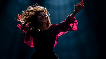 Obraz premium Emotions Freedom - Dynamic Silhouetted Woman In Pink Dancing With Joy, Hair Flying In Dramatic Motion.
