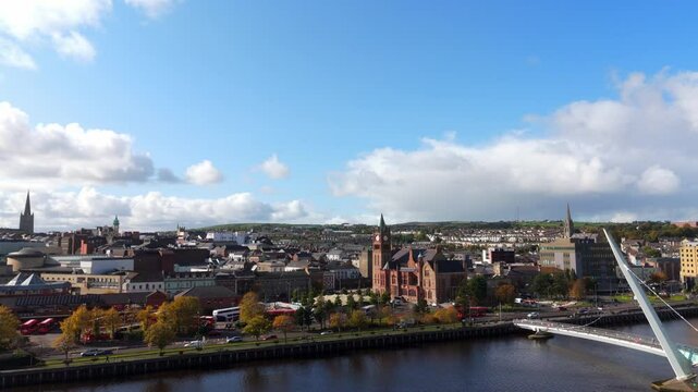 City of Derry aka Londonderry in Northern Ireland aerial view - A Beautiful Cityscape from above by the River Foyle Featuring the Beautiful Pedestrian Peace Bridge