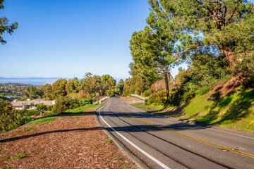 Countryside roads and streets with white fences, country landscape, coastal view, greenery in Rolling Hills CA 