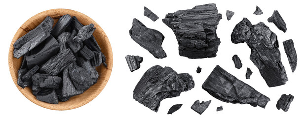 Natural charcoal in wooden bowl isolated on white background with full depth of field. Top view. Flat lay