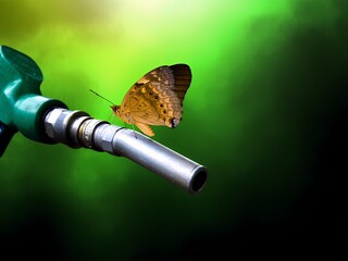 Butterfly Landing on HVO Fuel Nozzle, Symbolizing Harmony Between Renewable Energy and Nature