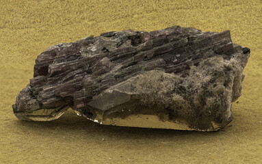 Striking specimen of elbaite tourmaline crystals, intertwined with quartz and lepidolite, set against a vibrant yellow backdrop, highlighting the intricate details and natural beauty of minerals