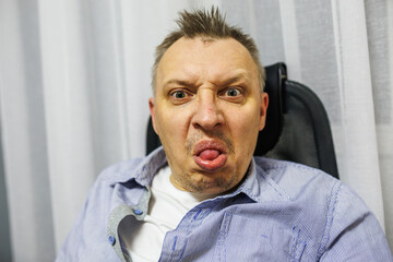 Obraz premium the face of an angry person dissatisfied with life and everything that happens