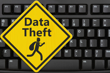 Data Theft warning with thief sign
