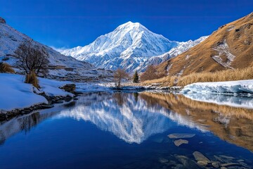 Naklejka premium Majestic Snow Capped Mountain Reflected In Still Water