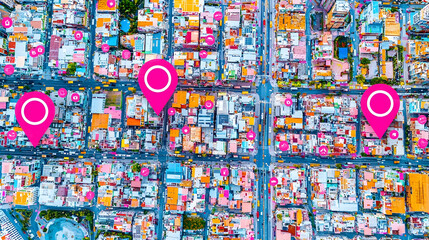 Aerial view of city map with highlighted location markers. Urban landscape with numerous buildings and streets. Potential use for location services or real estate